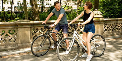 a Young Couple Cycling in Central Park